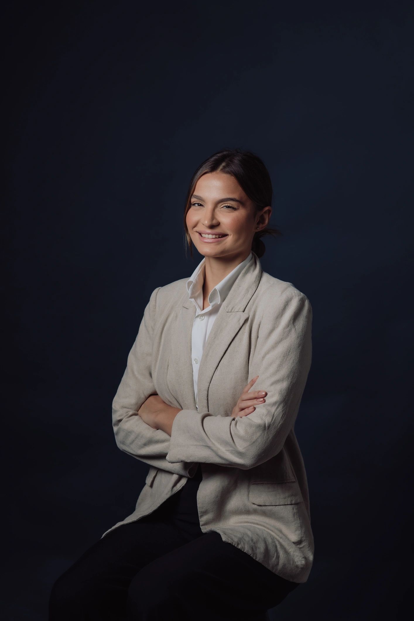 Studio portrait with deep blue background